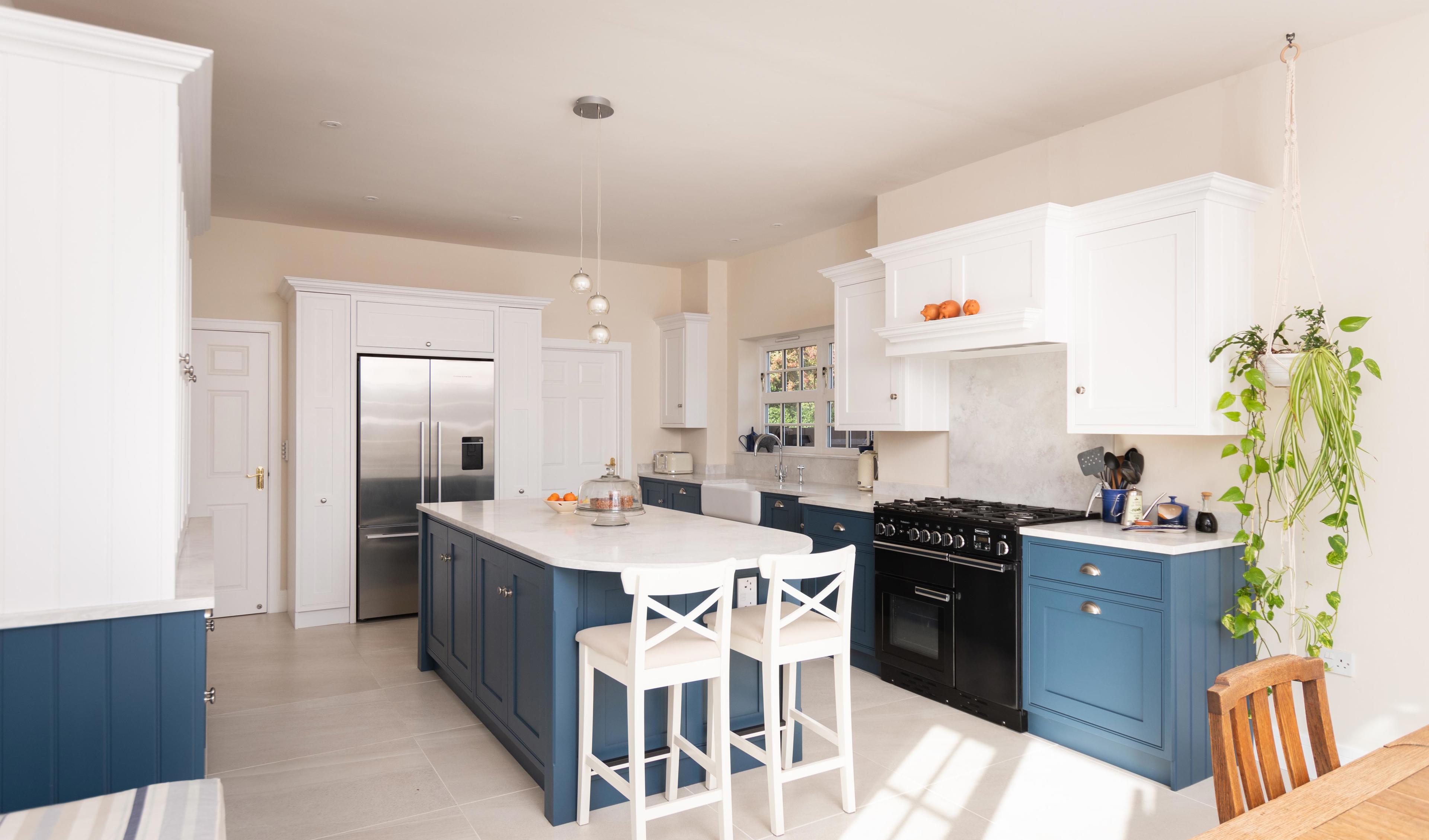 They wanted to make the kitchen more spacious and user friendly, so the wall dividing the kitchen and dining room was removed. This created a more open plan space to work with.